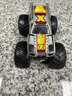Hot Wheels Silver Monster Truck Toy with Yellow Flame X Decals - Kids Vehicles